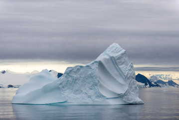 Antarctic landscape with iceberg, view from expedition ship