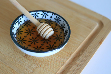 Honey with wooden honey dipper
