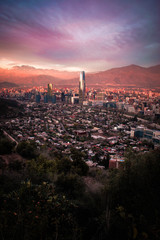skyscrapers at sunset with mountain