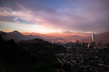 skyscrapers at sunset with mountain