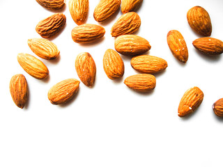 raw fresh almonds on white background