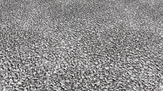 An aerial view over decorative white stone gravel - seamless looping.