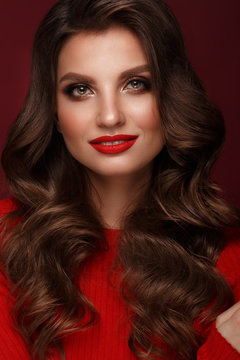 Beautiful sexy woman with classic make-up, wave hair and red lips. Beauty face.