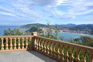 another classic beauty: a view from the fringed balustrade of the terrace on Monte Igueldo to La Concha Bay, Monte Urgull and San Sebastian