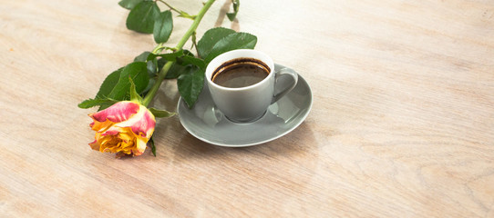 Fresh italian style coffee next to flower bouquet