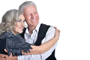 Close up portrait of happy senior couple hugging