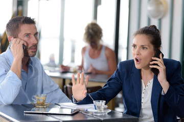 man and woman talking angry on the phone