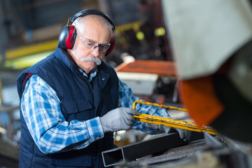 machine operator making steel bars