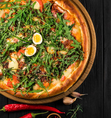 Hot pizza on a black background.