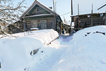 Russian village in winter, in the snow.