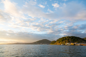Golden sunset in the sky over the Avacha Bay, Kamchatka Peninsula, Russia.