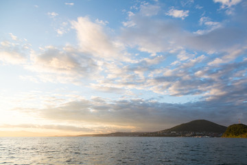 Fototapeta premium Golden sunset in the sky over the Avacha Bay, Kamchatka Peninsula, Russia.