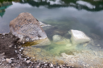 Small Valley of Geysers, Kamchatka Peninsula, Russia. This is a unique active fumarole field, the hot gases of which pass through the water of a cold stream, heating it and creating a gushing effect.