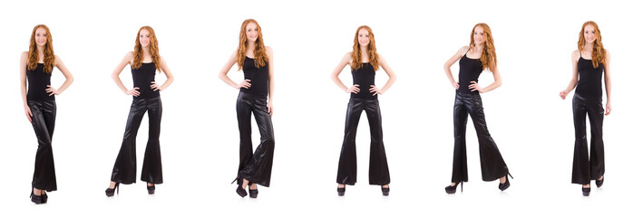 Redhead woman in black bell bottom pants on white