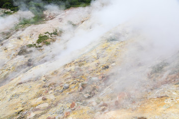 Small Valley of Geysers, Kamchatka Peninsula, Russia. This is a unique active fumarole field, the hot gases of which pass through the water of a cold stream, heating it and creating a gushing effect.