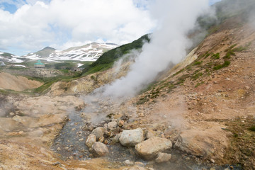 Small Valley of Geysers, Kamchatka Peninsula, Russia. This is a unique active fumarole field, the hot gases of which pass through the water of a cold stream, heating it and creating a gushing effect.