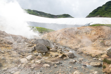 Small Valley of Geysers, Kamchatka Peninsula, Russia. This is a unique active fumarole field, the hot gases of which pass through the water of a cold stream, heating it and creating a gushing effect.