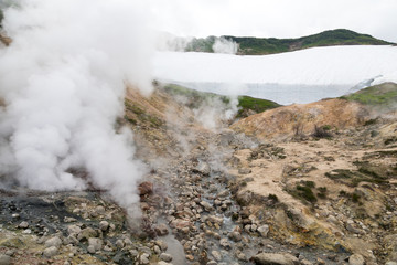 Small Valley of Geysers, Kamchatka Peninsula, Russia. This is a unique active fumarole field, the hot gases of which pass through the water of a cold stream, heating it and creating a gushing effect.