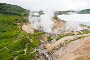 Small Valley of Geysers, Kamchatka Peninsula, Russia. This is a unique active fumarole field, the hot gases of which pass through the water of a cold stream, heating it and creating a gushing effect.