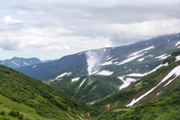 Small Valley of Geysers, Kamchatka Peninsula, Russia. This is a unique active fumarole field, the hot gases of which pass through the water of a cold stream, heating it and creating a gushing effect.