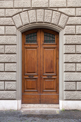 Fototapeta na wymiar ancient wooden arched door, Italy Europe 