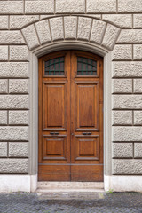 Fototapeta premium ancient wooden arched door, Italy Europe 
