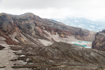 Gorely Volcano, Kamchatka Peninsula, Russia. An active volcano located in the south of Kamchatka. It consists of 11 cones and about 30 craters. Some craters are filled with acid or fresh water.