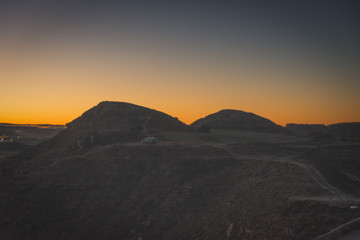 landscape photography of mountains at sunset, backlight with orange effect