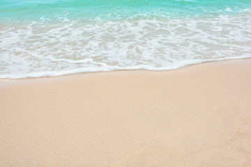 Summer beach concept - Soft wave of sea on empty sandy beach Background with copy space.