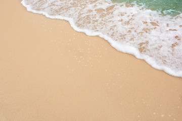 Summer beach concept - Soft wave of sea on empty sandy beach Background with copy space.