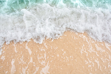 Summer beach concept - Soft wave of sea on empty sandy beach Background with copy space.