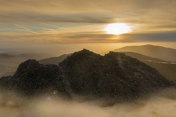 Tryfan mountain sunrise in Snowdonia National Park with fog and low cloud