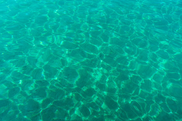 Fototapeta na wymiar Crystal clear water in the sea of Sithonia, Greece