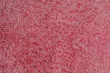 Abstraction background. Texture of red terry cloth.