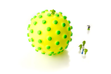 the team of miniature figurines interfering during gas and other chemical accidents, preparing for diagnosis and action against very dangerous deadly corona virus type on white background