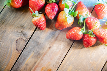strawberry berries close up on a wood background