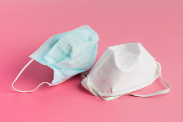 a surgical masks and a N95 95 percent particulate face mask sometimes used for protection from...