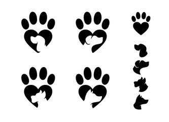 Dog paw shaped hearts emblems with dog faces. Vector illustration.