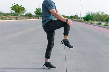 Man stretching his body with sportswear