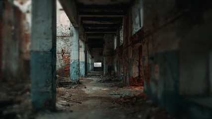 Long corridor of ruined abandoned eerie pillar industrial building with blurred vignette, vintage...
