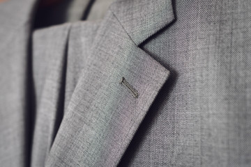 Close up of light grey woolen suit.
