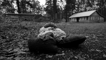 Toy on earth forgotten in an abandoned children's camp