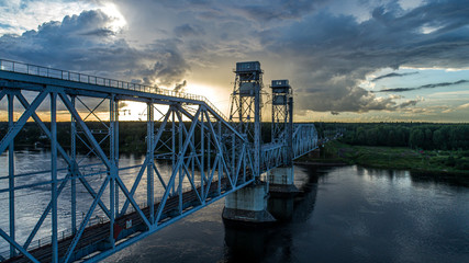 Double-deck drawbridge over the Neva River оn the sunset in Saint-Petersburg, Russia.