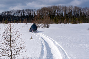 Winter freedom - snowmobiling in fresh snow