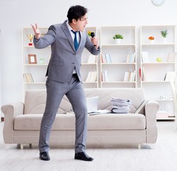 Drunk businessman celebrating in the office