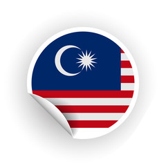 Sticker of Malaysia flag with peel off corner isolated on white background. Paper banner or circle curl label sticker with flip edge. Vector color post note for advertising design.