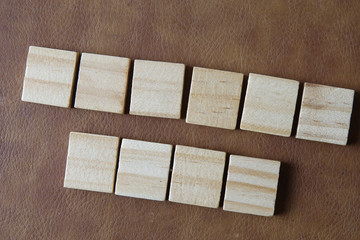 Empty  wooden blocks on brown background. Business concept.