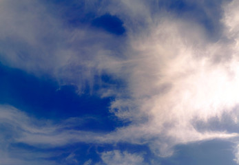 Fototapeta na wymiar Bright blue sky with clouds, background for design, decoration or wallpaper