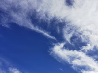 Fototapeta premium Bright blue sky with clouds, background for design, decoration or wallpaper