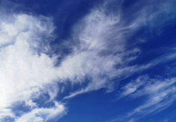 Naklejka na ściany i meble Bright blue sky with clouds, background for design, decoration or wallpaper